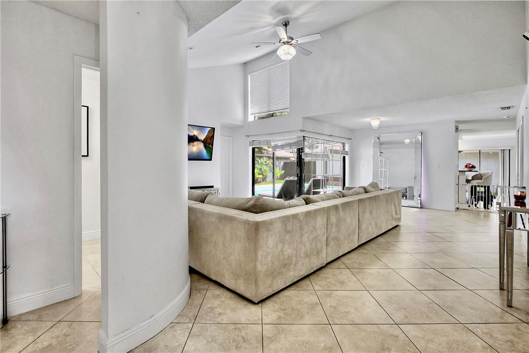 106 Kensington Road Hollywood, FL 33021 - Photo 8 of 42 a living room with furniture and a table