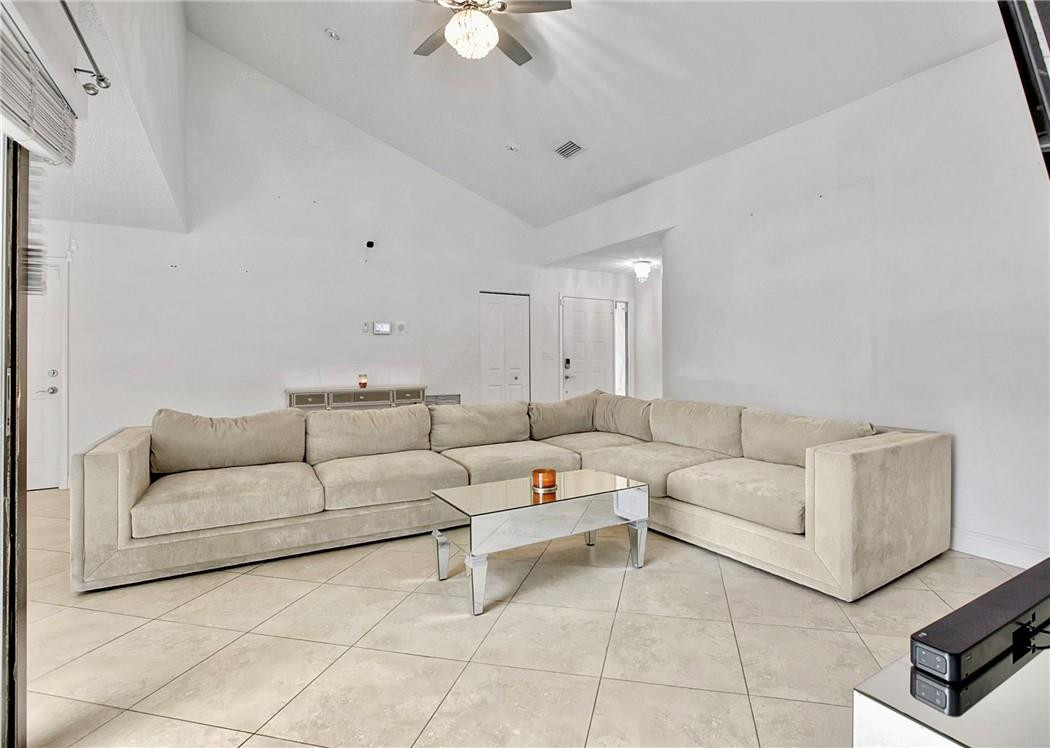 106 Kensington Road Hollywood, FL 33021 - Photo 9 of 42 a living room with furniture and a ceiling fan