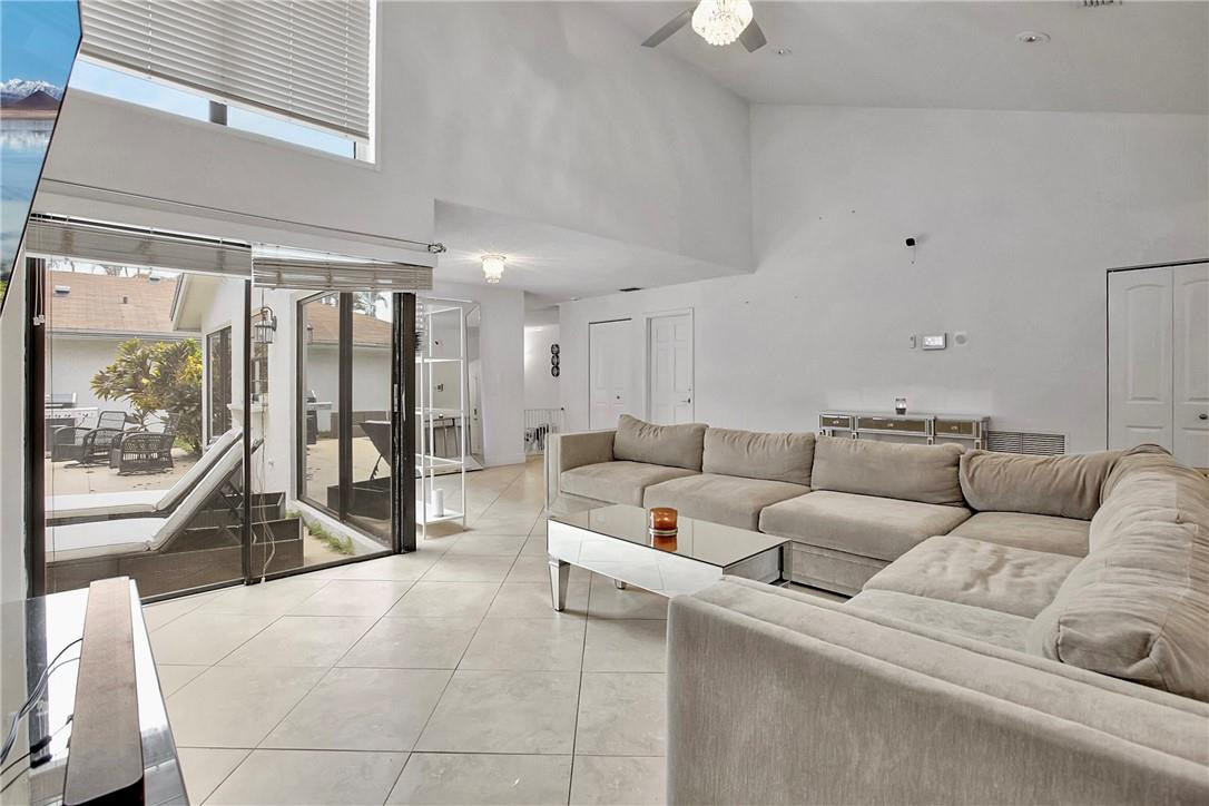 106 Kensington Road Hollywood, FL 33021 - Photo 10 of 42 a living room with furniture and a large window