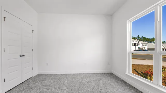 a view of an empty room and window