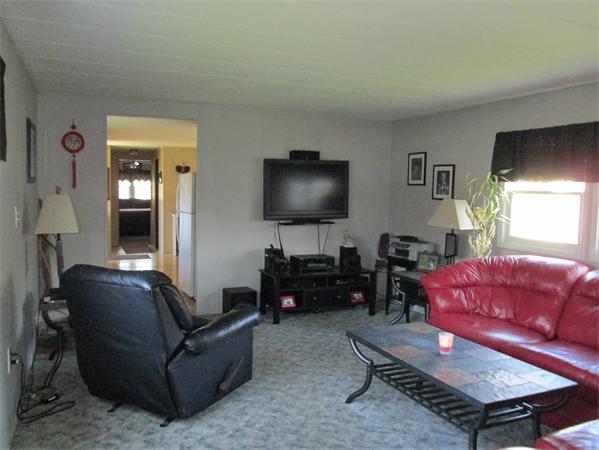 72 Hathaway Road Acushnet, MA 02743 - Photo 5 of 13 a living room with furniture and a flat screen tv