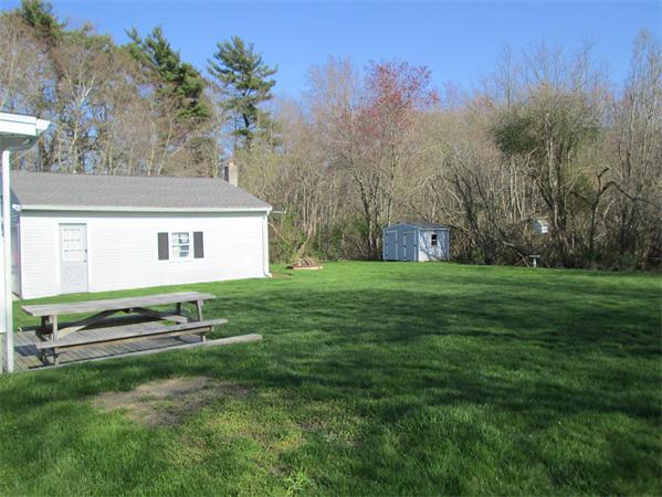 72 Hathaway Road Acushnet, MA 02743 - Photo 10 of 13 a front view of a house with a yard
