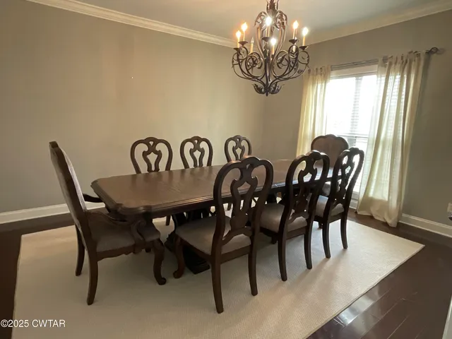 a bathroom with a tub sink shower and mirror