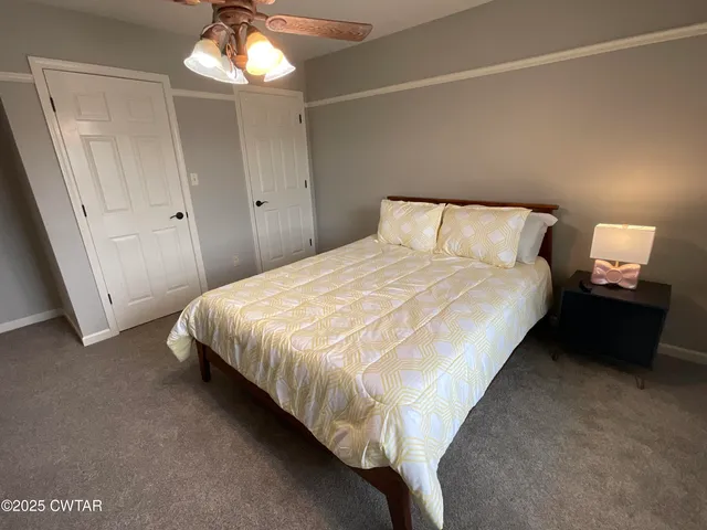 a bathroom with a double vanity sink and mirror