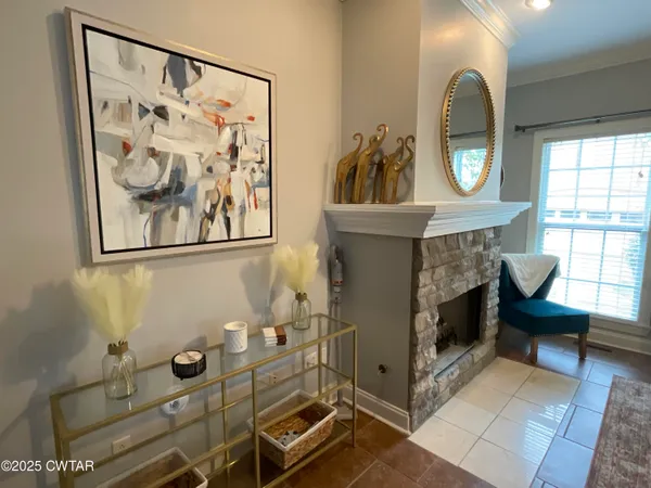 a view of a entryway with furniture and a potted plant