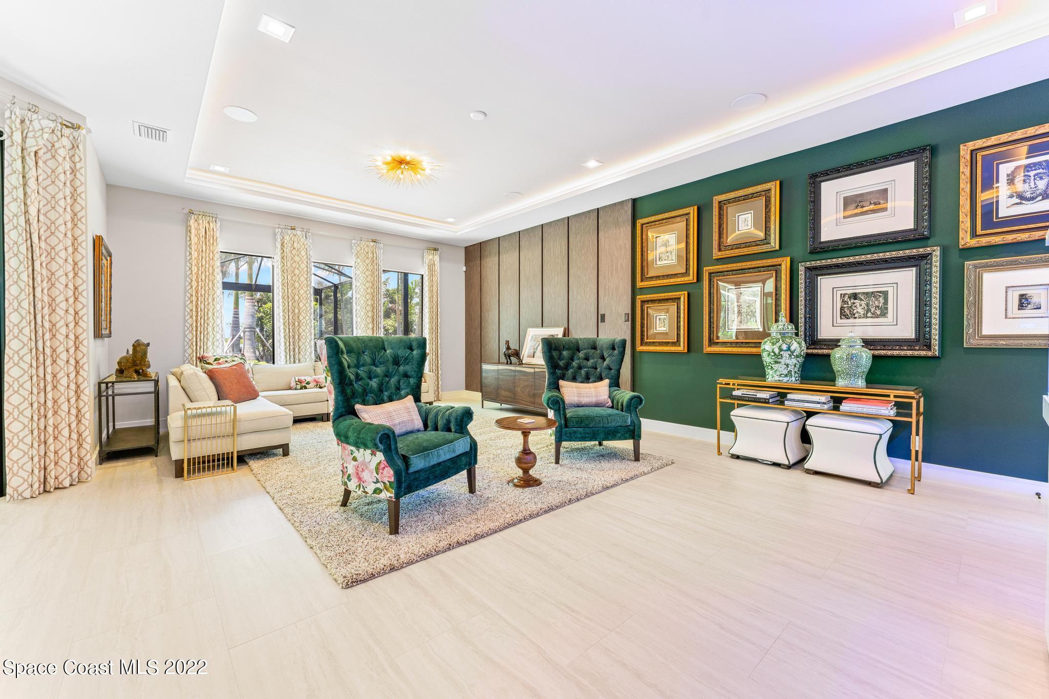 4574 Milost Drive Rockledge, FL 32955 - Photo 12 of 41 a living room with furniture potted plant and a large window