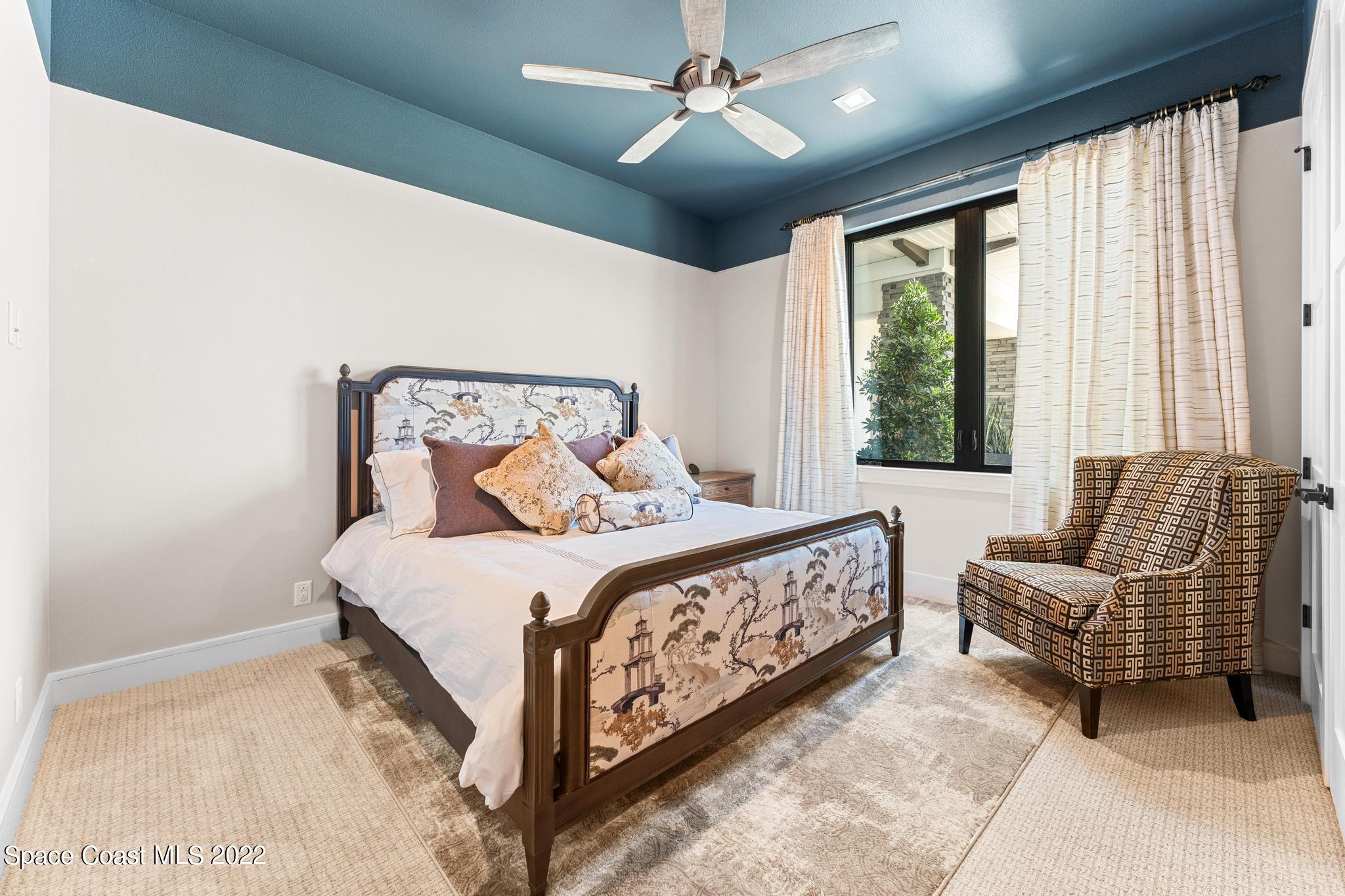 4574 Milost Drive Rockledge, FL 32955 - Photo 19 of 41 a bedroom with a bed couch and window