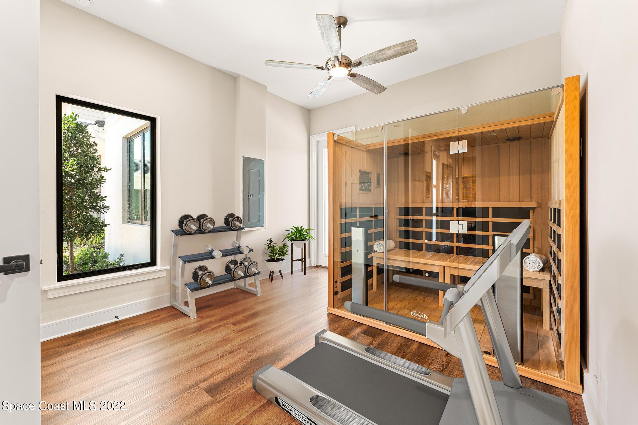 4574 Milost Drive Rockledge, FL 32955 - Photo 23 of 41 a living room with furniture a dining table and wooden floor