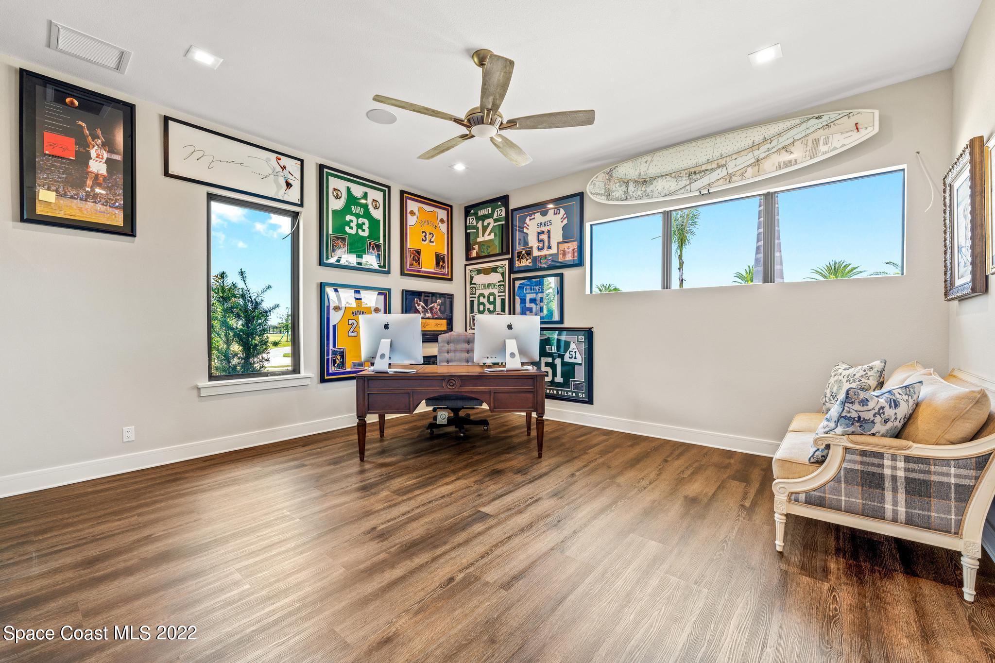 4574 Milost Drive Rockledge, FL 32955 - Photo 27 of 41 a living room with furniture and a wooden floor