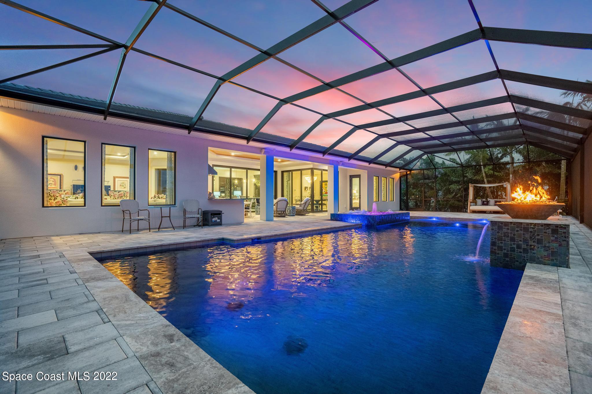 4574 Milost Drive Rockledge, FL 32955 - Photo 33 of 41 a view of a swimming pool with a patio