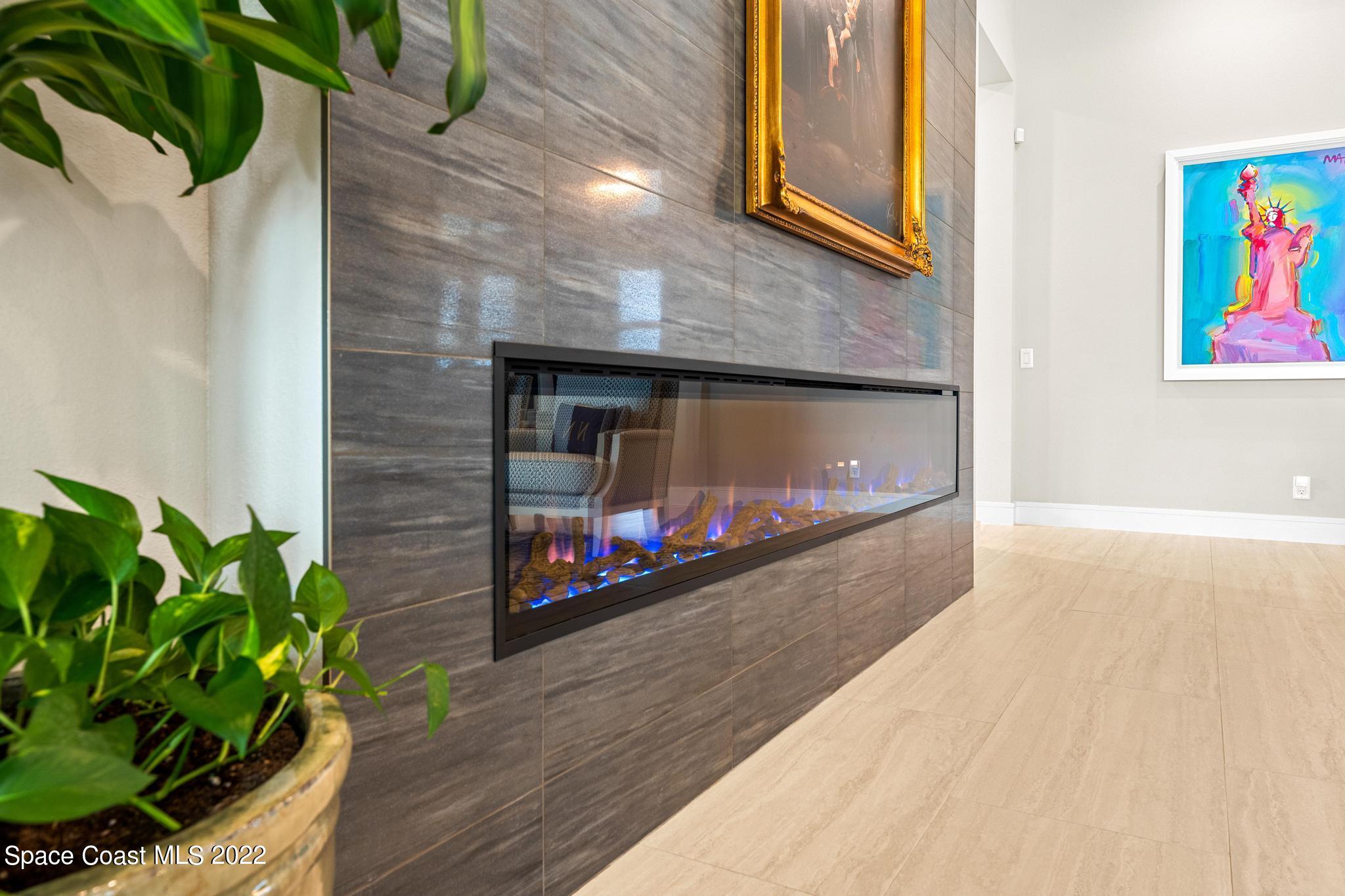 4574 Milost Drive Rockledge, FL 32955 - Photo 4 of 41 a living room with furniture with a fireplace