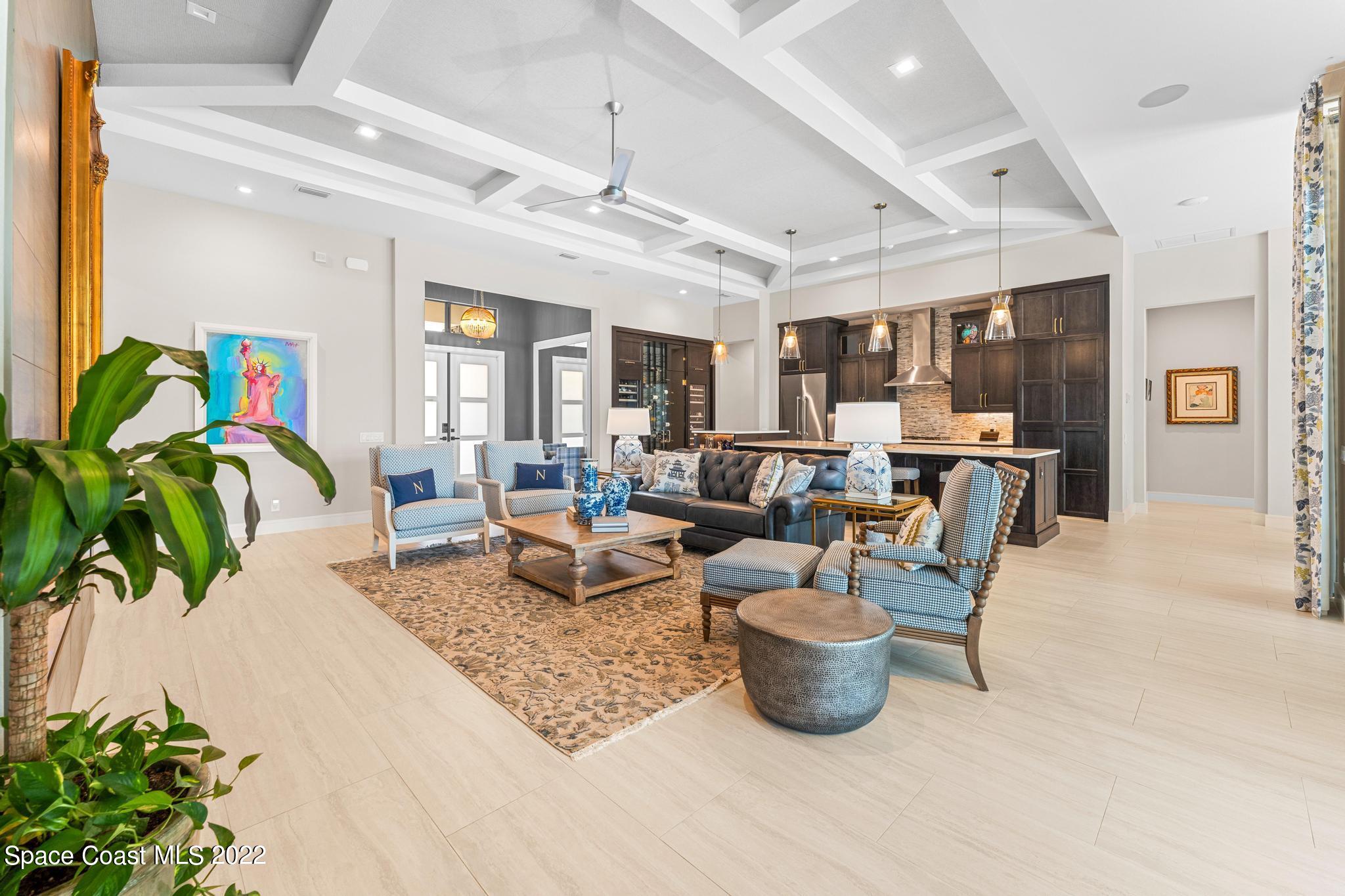 4574 Milost Drive Rockledge, FL 32955 - Photo 5 of 41 a living room with lots of furniture and a potted plant