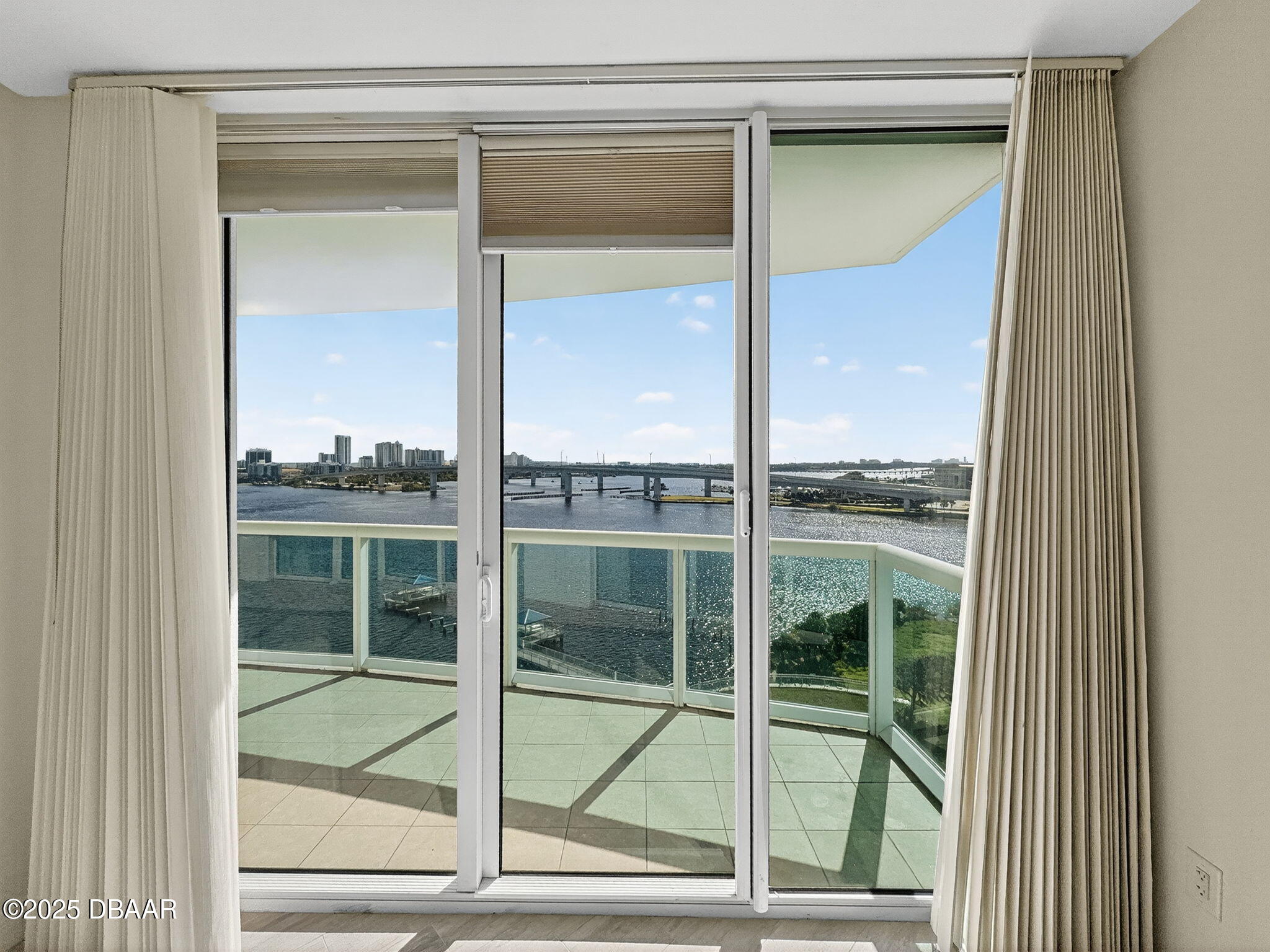 231 Riverside Drive, Unit 903 Holly Hill, FL 32117 - Photo 14 of 28 a view of a glass door with a door