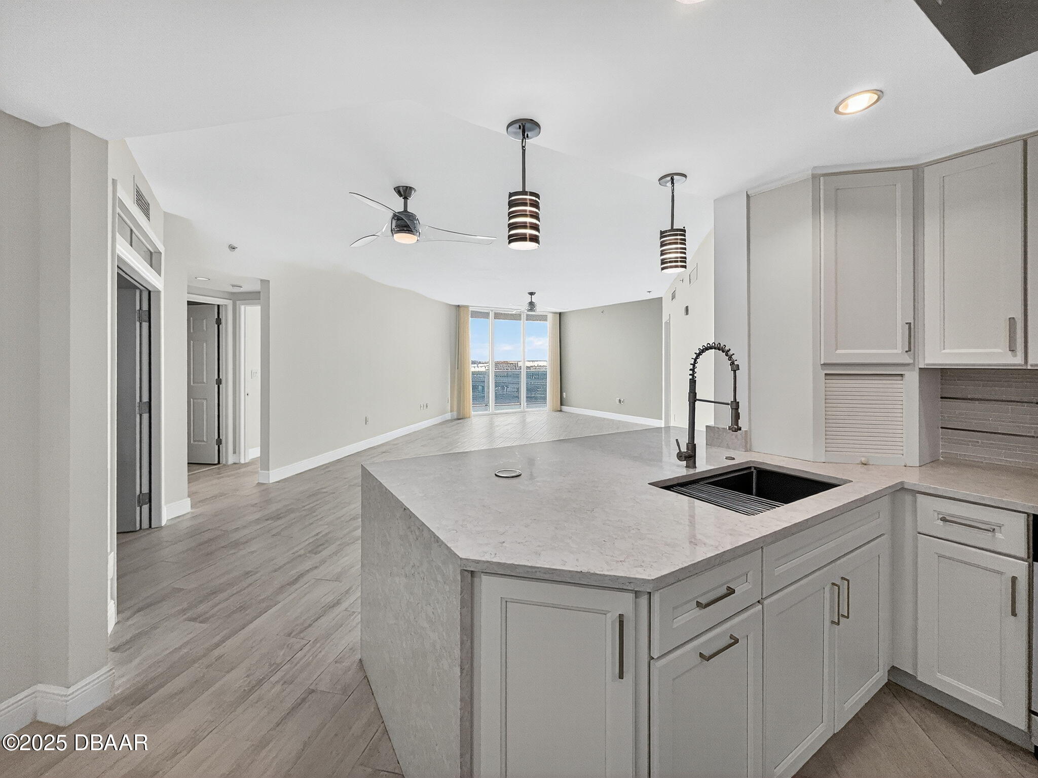 231 Riverside Drive, Unit 903 Holly Hill, FL 32117 - Photo 8 of 28 a kitchen with sink and cabinets