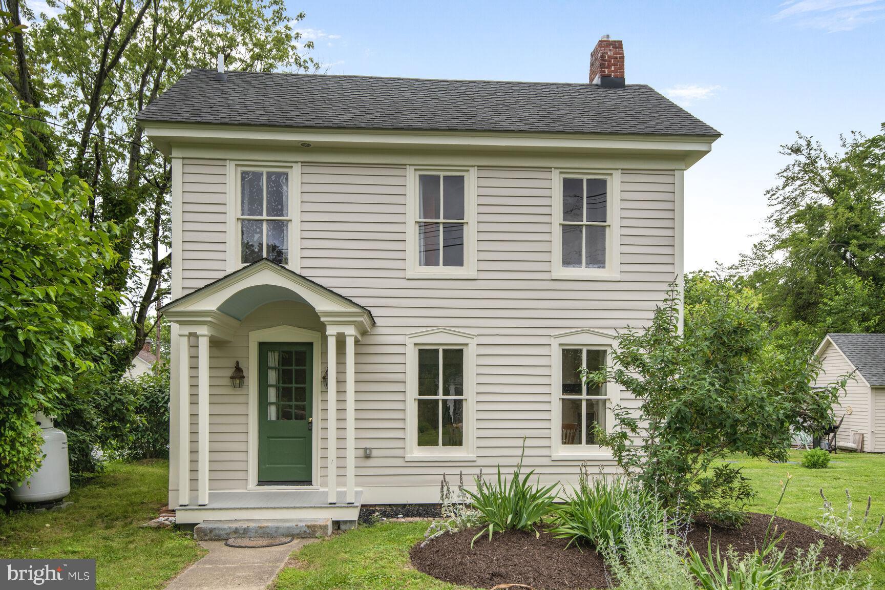 7651 Main Street Tilghman, MD 21671 - Photo 11 of 35 a front view of a house with a yard