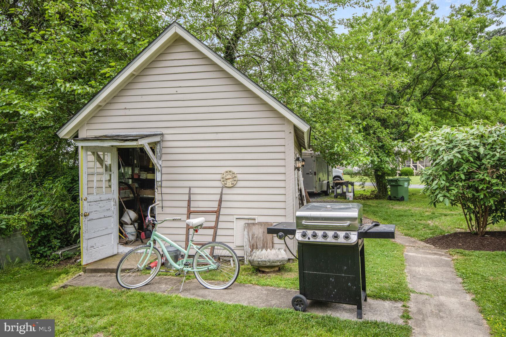 7651 Main Street Tilghman, MD 21671 - Photo 12 of 35 a view of a house with backyard and a garden