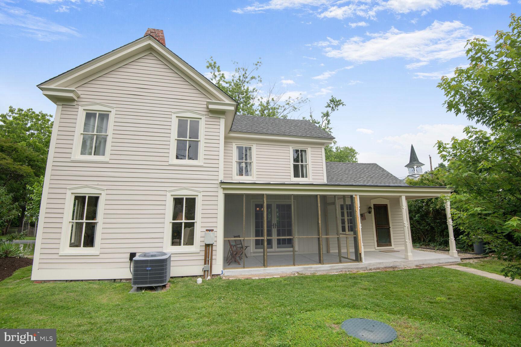 7651 Main Street Tilghman, MD 21671 - Photo 14 of 35 a front view of house with yard and green space
