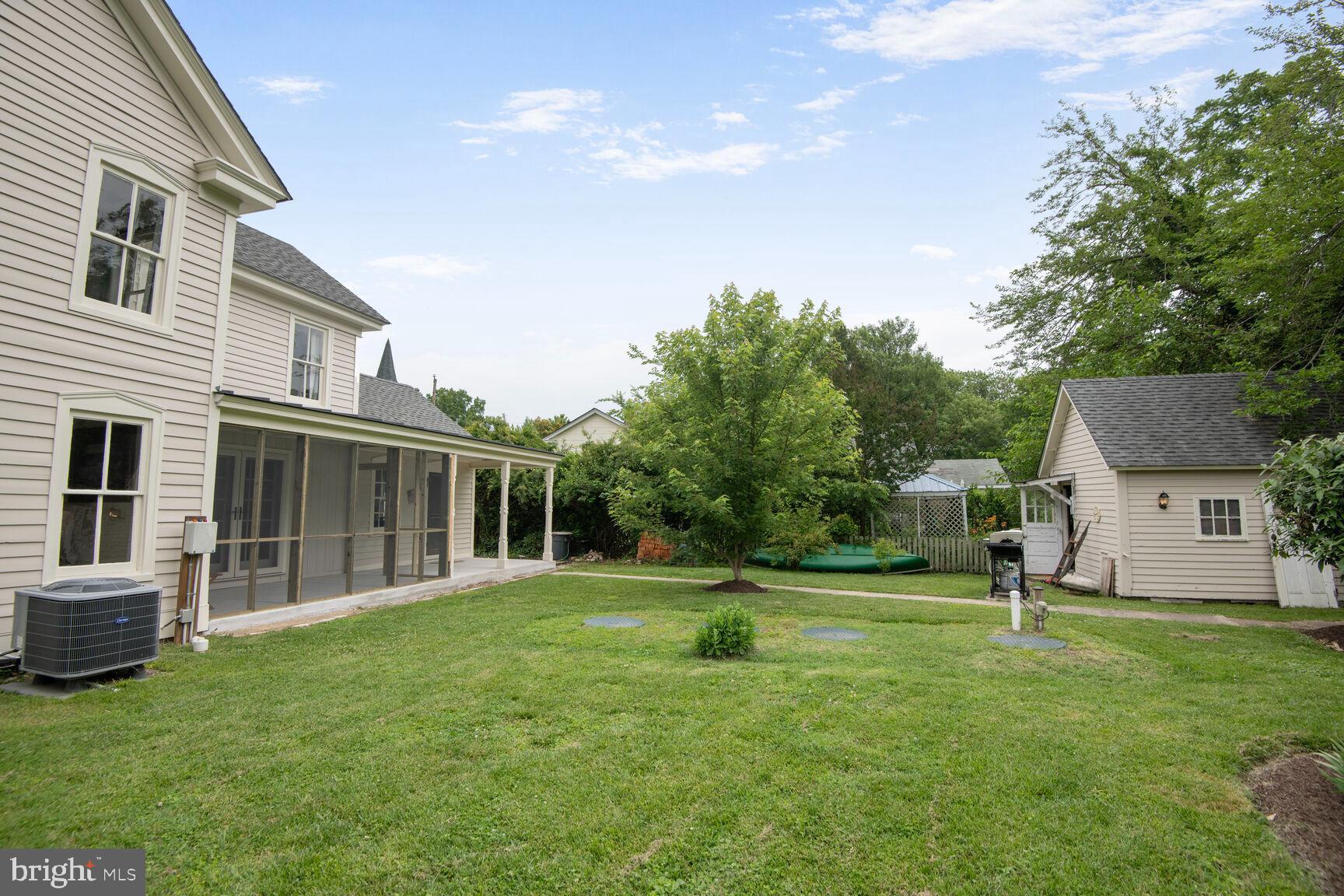7651 Main Street Tilghman, MD 21671 - Photo 15 of 35 a backyard of a house with lots of green space