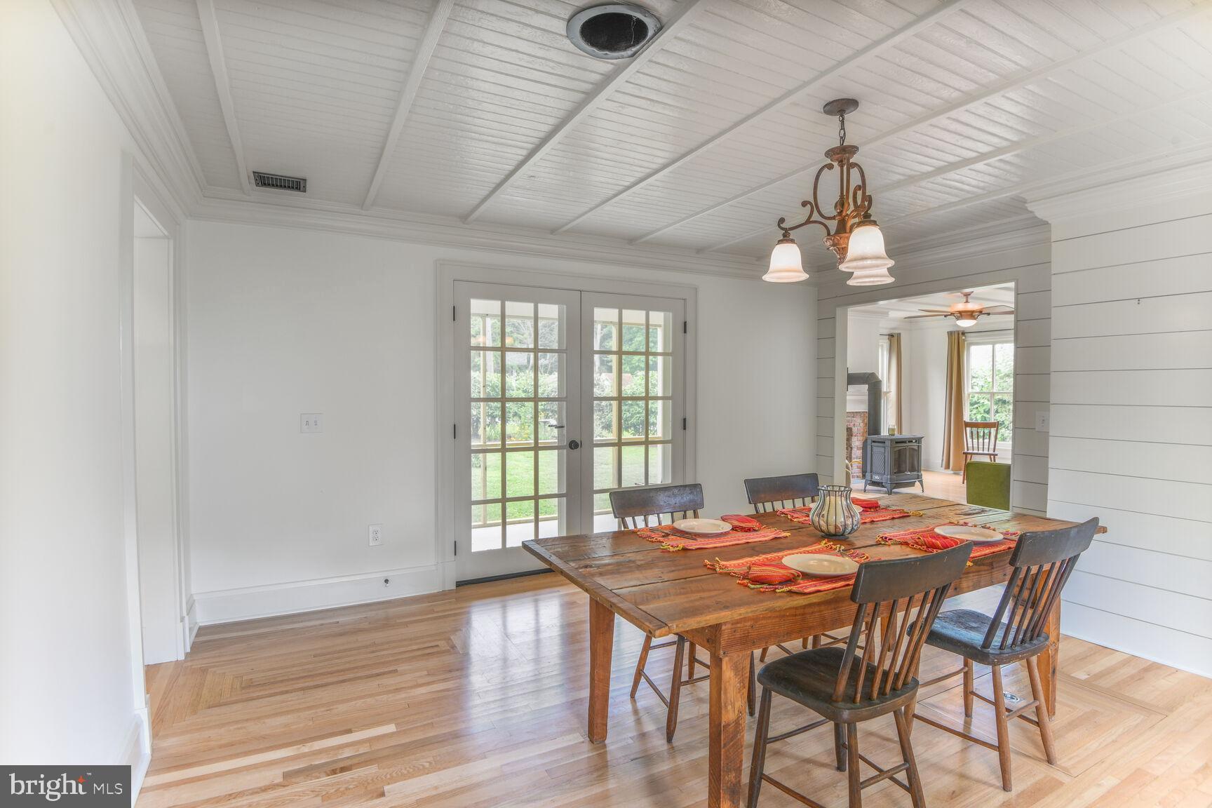 7651 Main Street Tilghman, MD 21671 - Photo 20 of 35 a view of a dining room with furniture and window