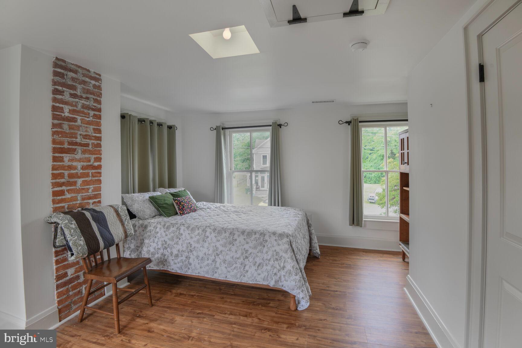 7651 Main Street Tilghman, MD 21671 - Photo 26 of 35 a bedroom with a bed and windows