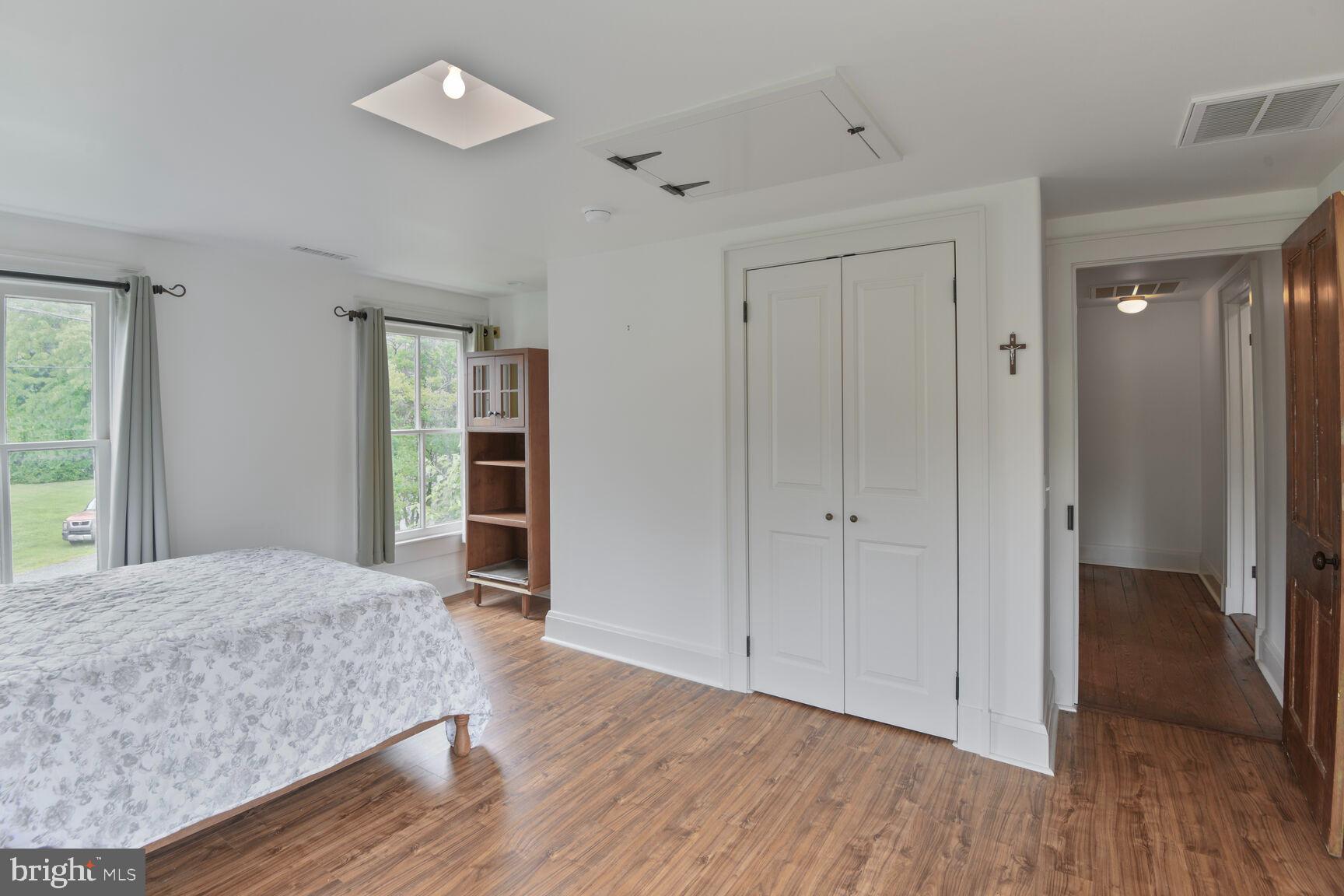 7651 Main Street Tilghman, MD 21671 - Photo 27 of 35 wooden floor in an empty room with a window