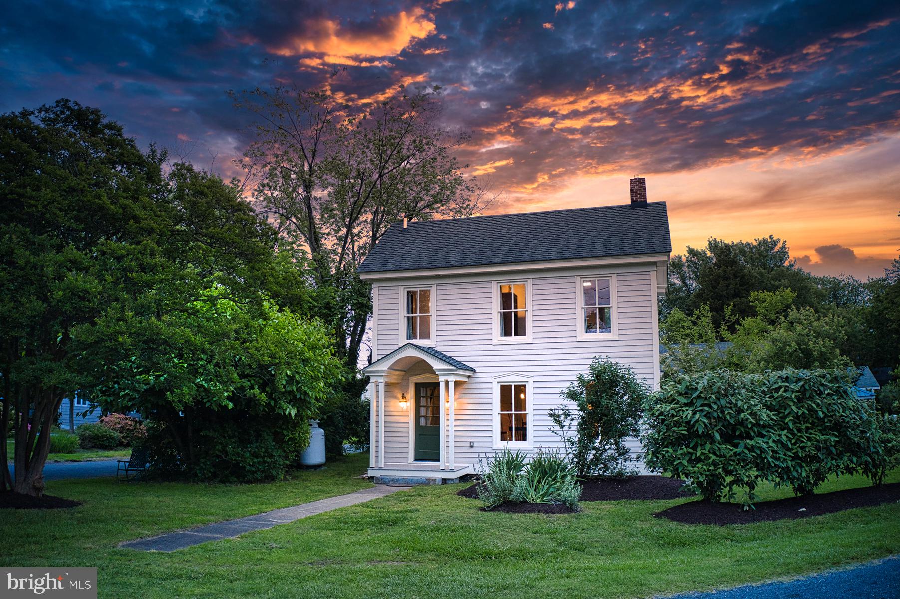 7651 Main Street Tilghman, MD 21671 - Photo 3 of 35 front view of a house with a yard