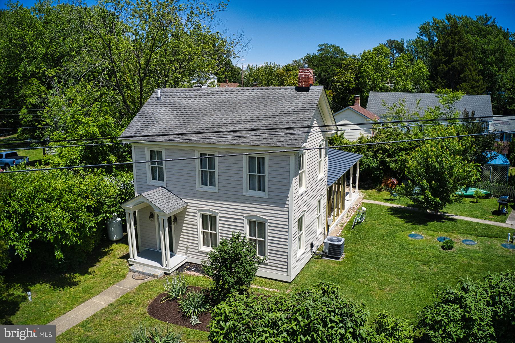7651 Main Street Tilghman, MD 21671 - Photo 5 of 35 a aerial view of a house with a yard