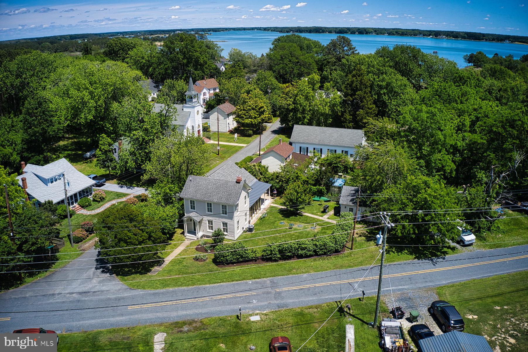 7651 Main Street Tilghman, MD 21671 - Photo 6 of 35 an aerial view of a house with garden space and street view