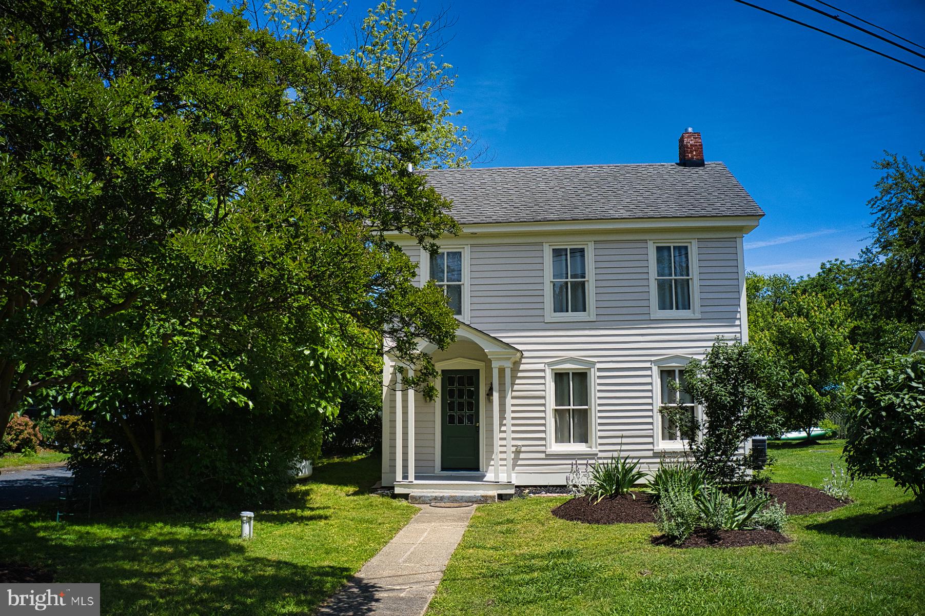 7651 Main Street Tilghman, MD 21671 - Photo 9 of 35 a front view of a house with a yard