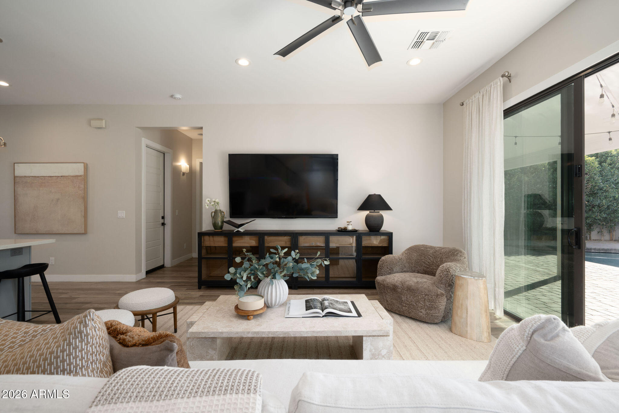 4533 East Montecito Avenue Phoenix, AZ 85018 - Photo 11 of 29 a living room with furniture and a flat screen tv