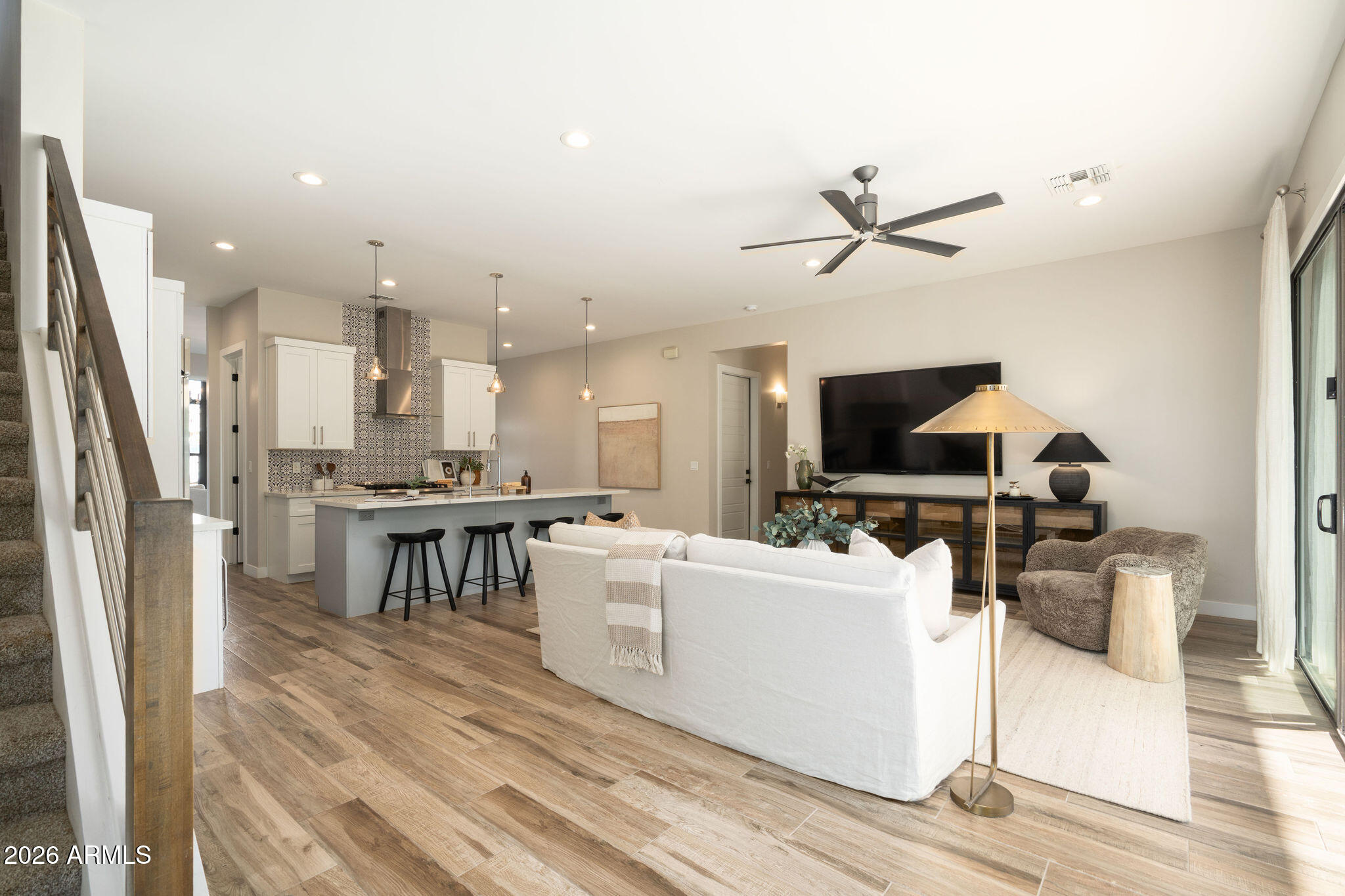 4533 East Montecito Avenue Phoenix, AZ 85018 - Photo 13 of 29 a living room with furniture a flat screen tv and kitchen view