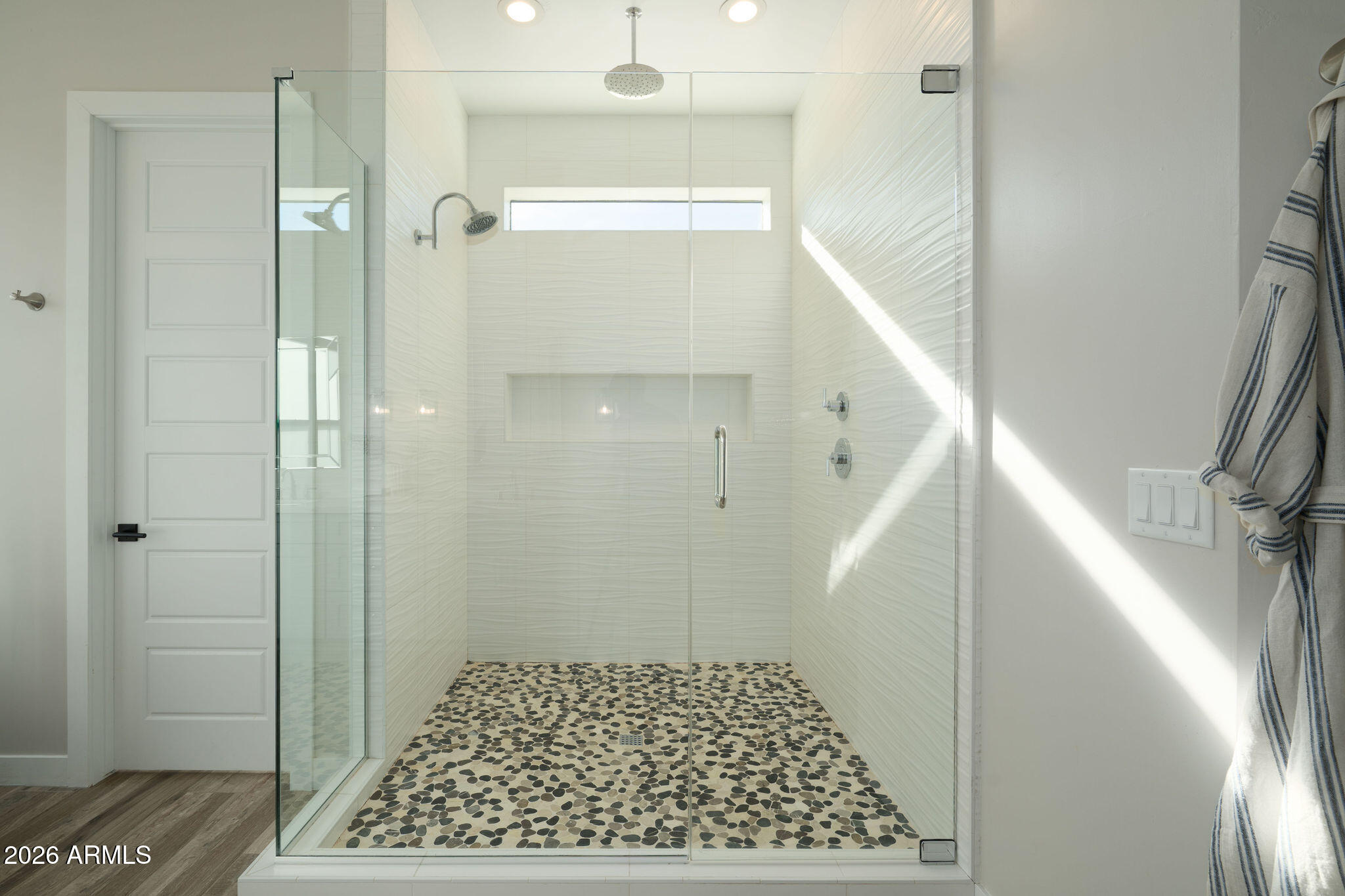 4533 East Montecito Avenue Phoenix, AZ 85018 - Photo 20 of 29 a bathroom with a glass shower door