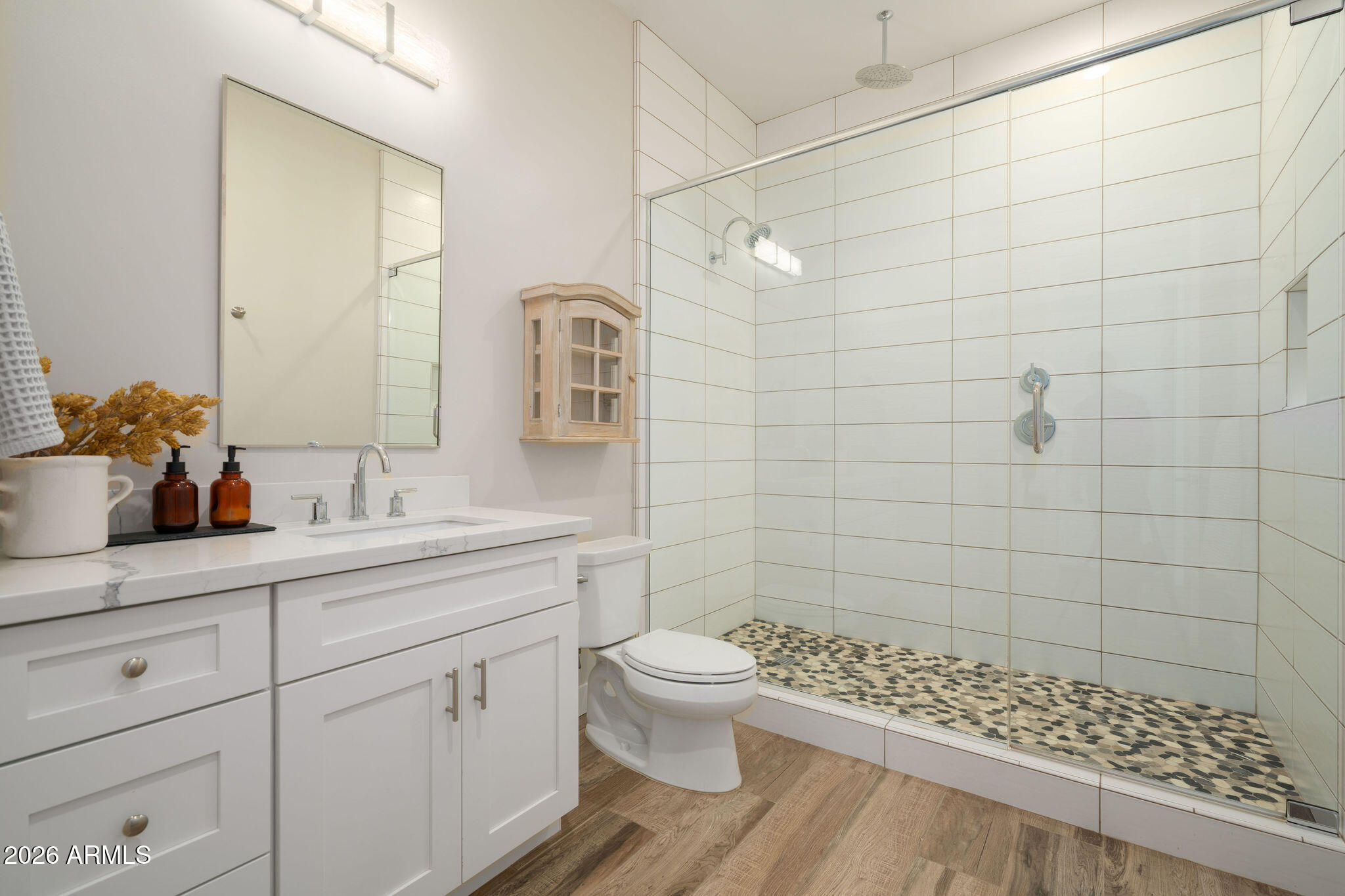 4533 East Montecito Avenue Phoenix, AZ 85018 - Photo 24 of 29 a bathroom with a sink a toilet and shower