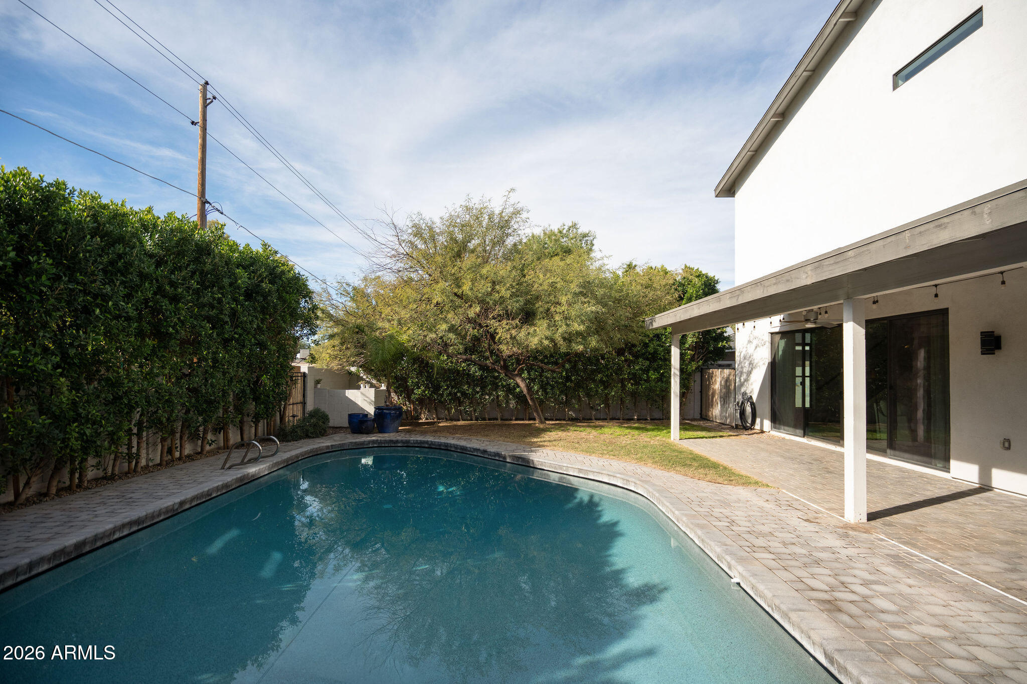 4533 East Montecito Avenue Phoenix, AZ 85018 - Photo 26 of 29 a view of a house with backyard and sitting area