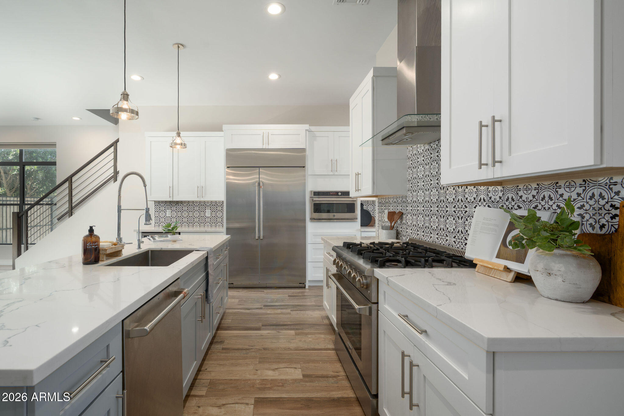 4533 East Montecito Avenue Phoenix, AZ 85018 - Photo 8 of 29 a kitchen with a sink stove and refrigerator