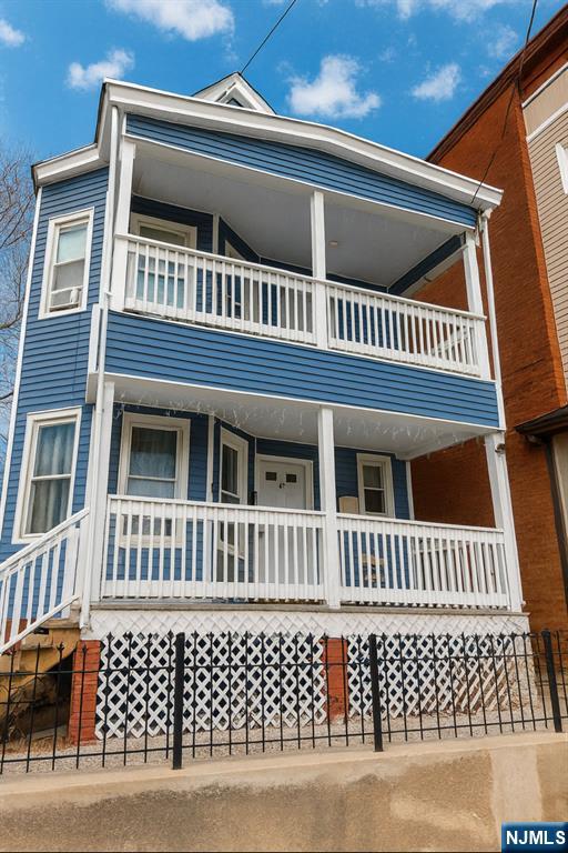 100 Rosa Parks Boulevard, Unit B1BY Paterson, NJ 07501 - Photo 9 of 10 a view of a house with wooden deck