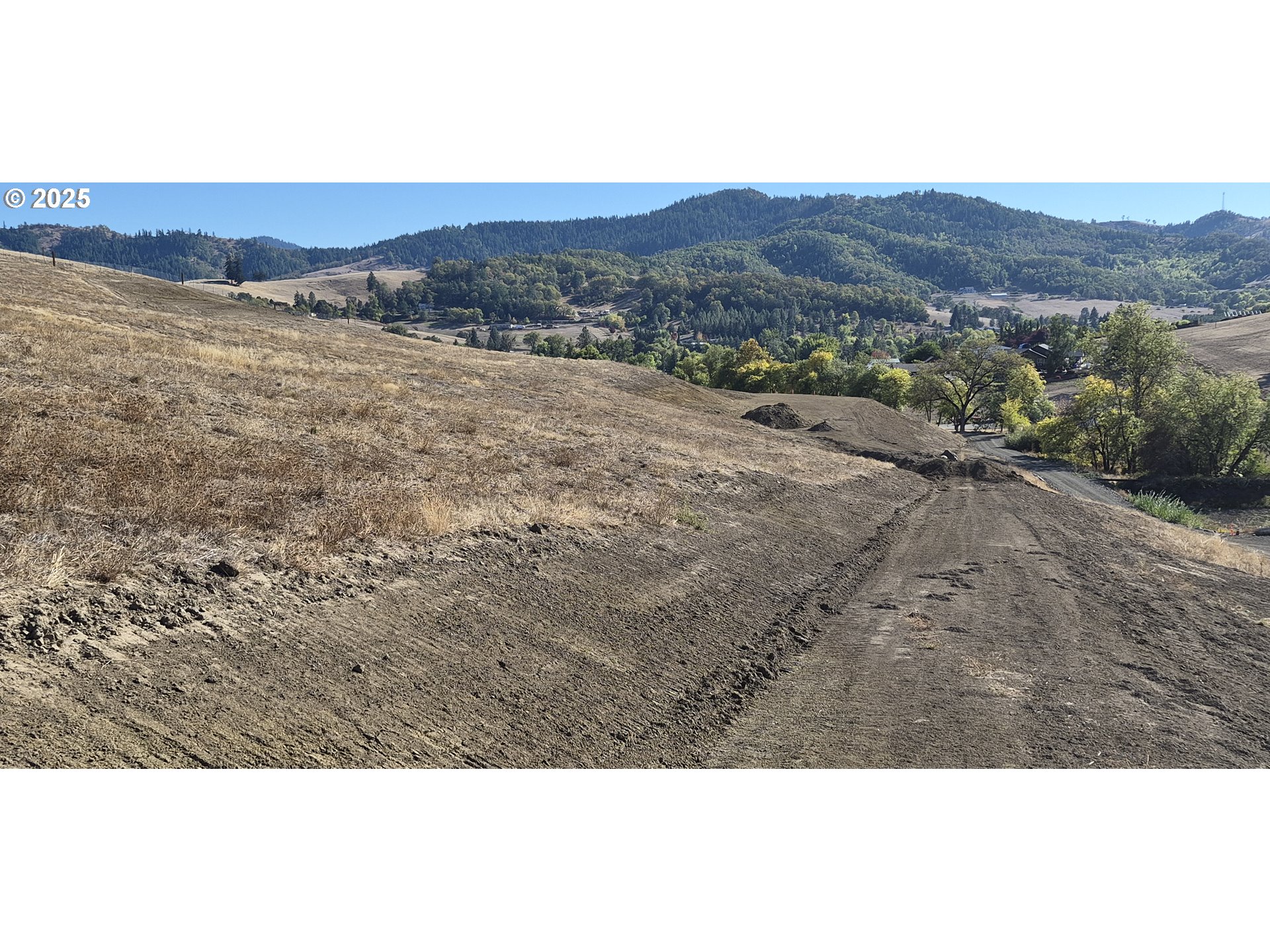 475 Ladybug Lane Roseburg, OR 97470 - Photo 3 of 12 a view of an outdoor space and mountain view