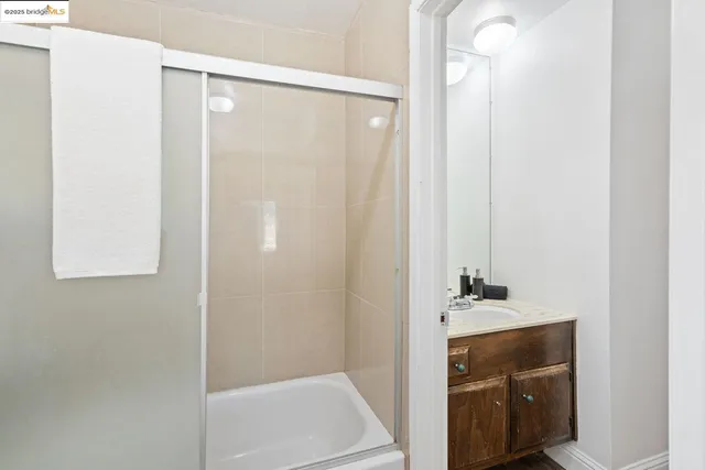 a bathroom with a shower and a sink
