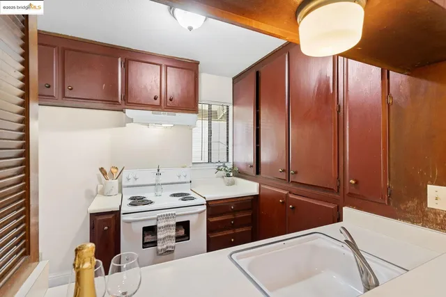a room with a sink cabinets and utility
