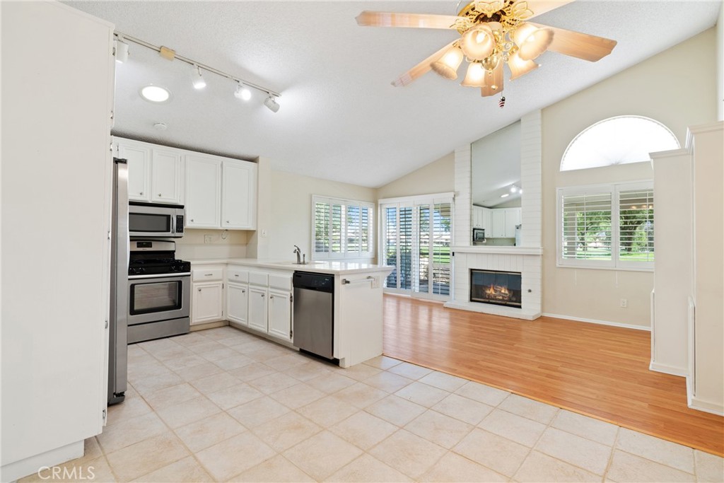 5772 Riviera Avenue Banning, CA 92220 - Photo 11 of 60 a large kitchen with cabinets a sink and stainless steel appliances