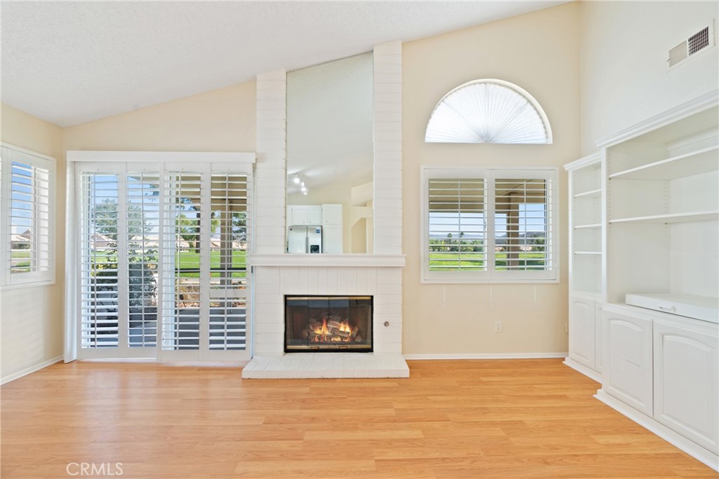 5772 Riviera Avenue Banning, CA 92220 - Photo 17 of 60 a view of an empty room with a window and fire place