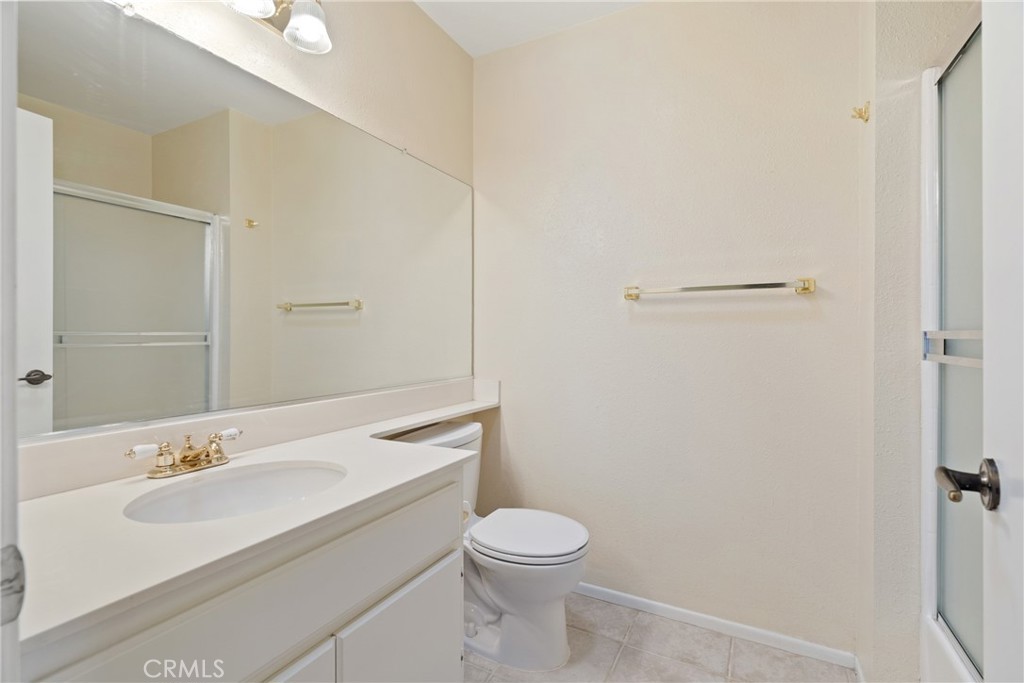 5772 Riviera Avenue Banning, CA 92220 - Photo 32 of 60 a bathroom with a sink toilet and vanity