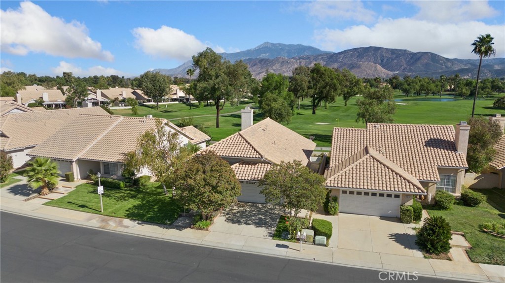5772 Riviera Avenue Banning, CA 92220 - Photo 49 of 60 an aerial view of a house with a garden and a yard