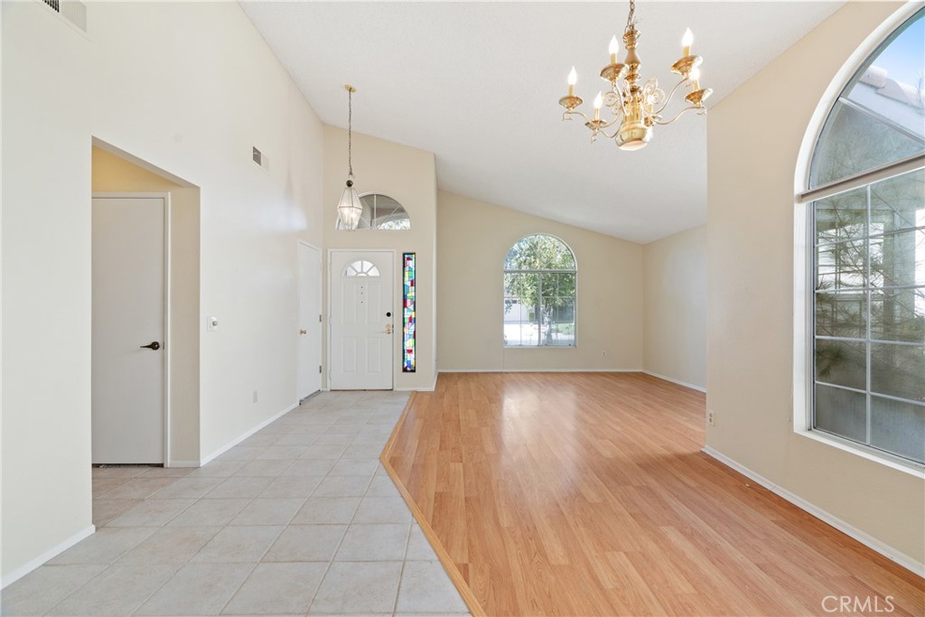 5772 Riviera Avenue Banning, CA 92220 - Photo 5 of 60 wooden floor in an empty room with a window