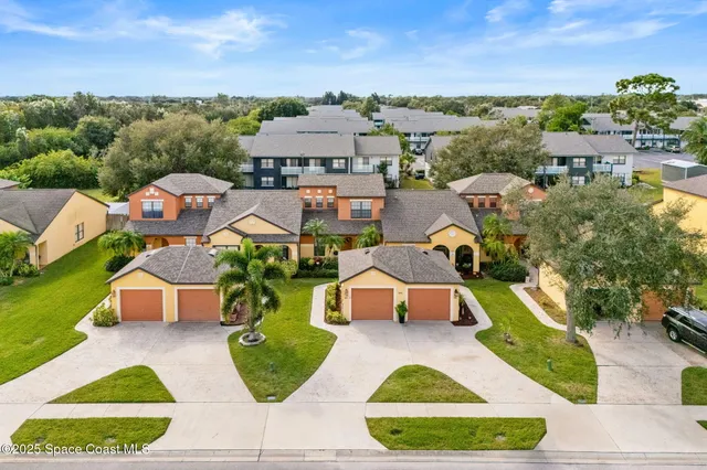 an aerial view of a house with a swimming pool