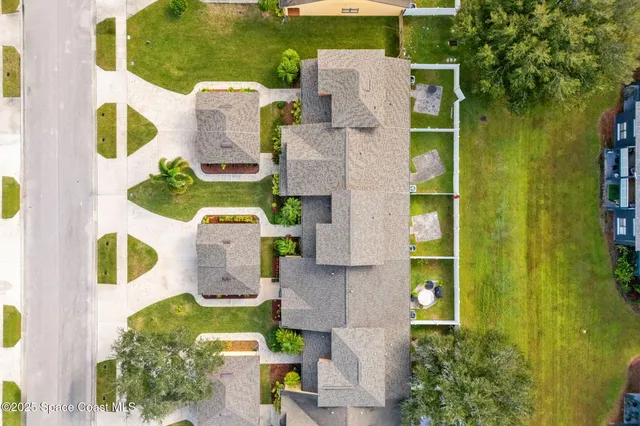 an aerial view of residential building with outdoor space