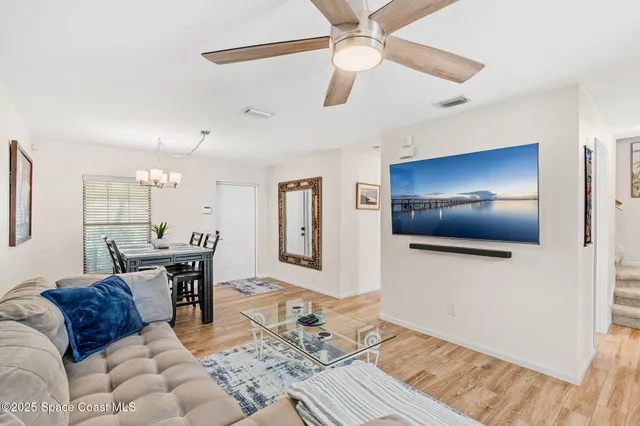 a kitchen with stainless steel appliances granite countertop a refrigerator a sink a stove a microwave and cabinets