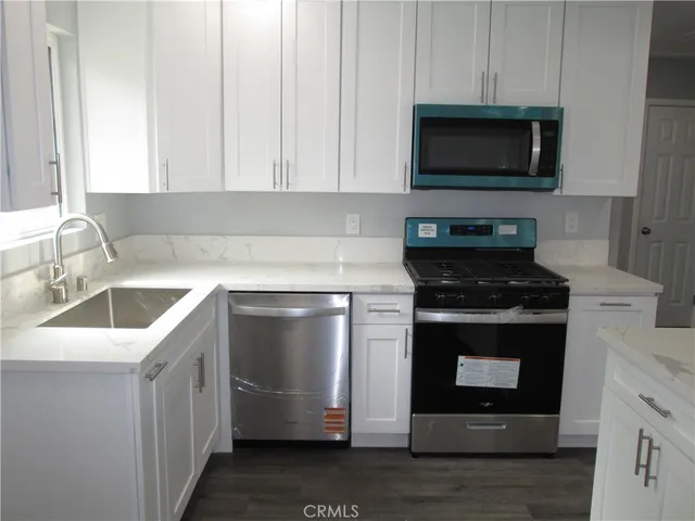 a kitchen with a stove and a microwave