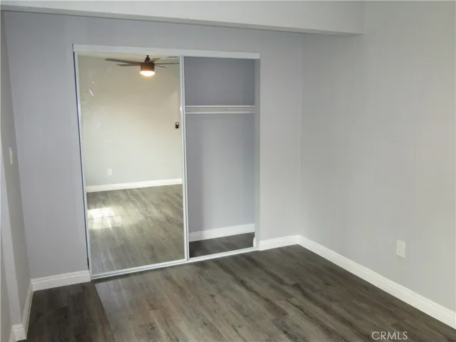 an empty room with wooden floor