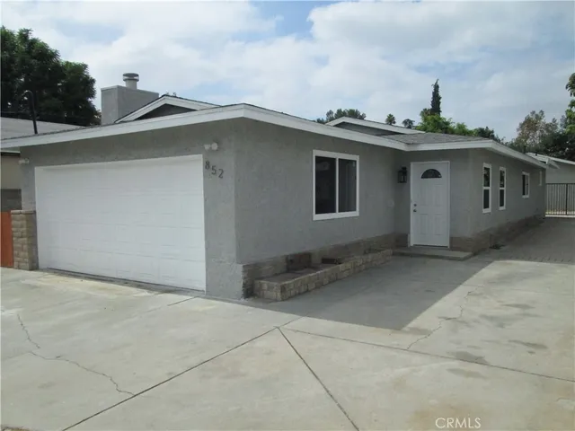 a view of a house with a garage